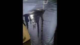 Sexy gf re wets her Jean's in the car, then finishes soaking them standing!