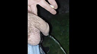 Pissing in the dark outside, uncut cock