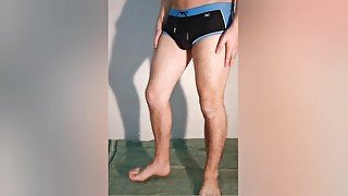 The guy shows what a chastity belt looks like under his clothes - a chastity cage in swimming trunks