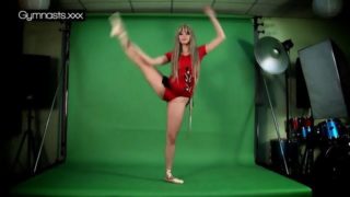 Red Dressed Gymnast Doing Spreads