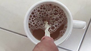 Piss into a cup with juice and making it overflow