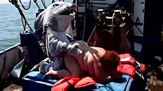 Feverish freak in fancy suit doggy fucks extremely fat redhead bitch on the boat