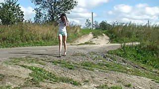 Gorgeous skinny brunette teen in sexy shorts pisses by the road