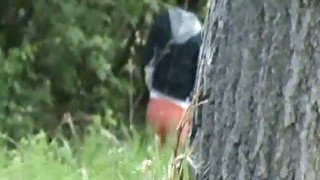 Redhead amateur white chick in the woods pisses behind the tree