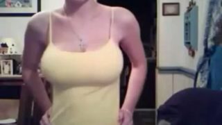 Slut in a tank top ready to take it off