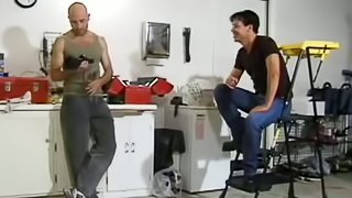 Two gay studs hang out in the garage and end up fucking