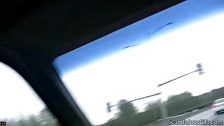 Hot Babe rubbing a cock while the guy driving caught on tape