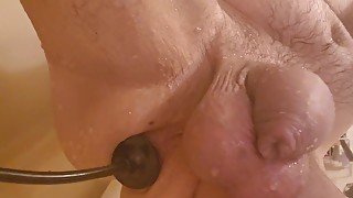 Stretching my cunt with my inflatable plug in the shower.