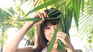 Slender Asian with sexy small tits teases solo outdoors