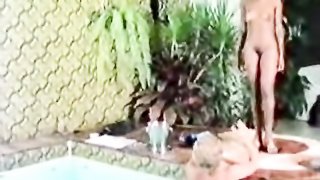 This brown skinned slut shaves her pussy and asshole by the pool