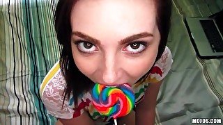 Lollipop licking teen girl sucks on a cock