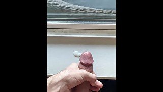 Jerking off in front of public window