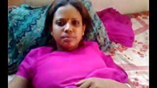 Dark skin authentic amateur Desi lady on the bed filmed