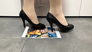 Girl trampling crushing paper in black high heels