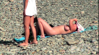 MILF with huge boobs fucking in the beach