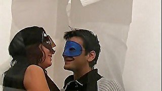 Sex in the office for two masked swingers