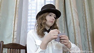 Larisa performs card tricks with her sexy top hat