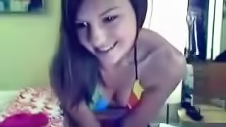 Rainbow bikini clings to teen body