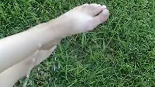 Pissing on girlfriends feet outdoors