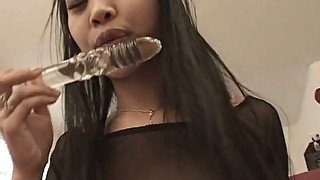 Asian hussy fucks herself with a glass dildo and then wants a real thing