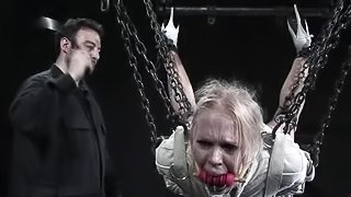 Blonde in straitjacket and gas mask gets humiliated