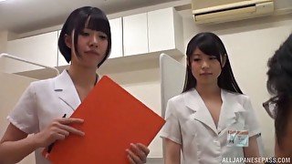 Lucky guy gets his dick pleasure by two Japanese babes on the floor