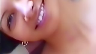 Smiling amateur striptease and masturbation