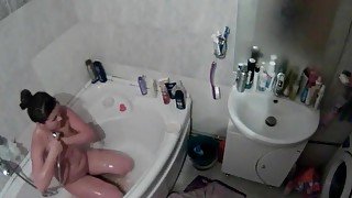 Curvy naked girl takes a sexy shower