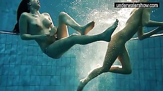 Two sexy amateurs showing their bodies off under water