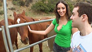 Splendid bitch in green top gives boy toy blowjob at a horse farm