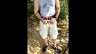 Public masturbation in the woods - jerking off by the water and cumming.