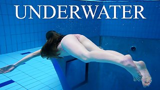 Sexy girl shows magnificent young body underwater