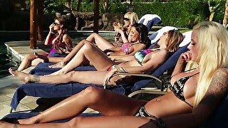 Several sex-hungry babes fuck each others cunts by the poolside