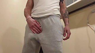 guy in gray pants.  bulging dick in your pants.  jerking dick.