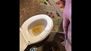 Fat guy peeing