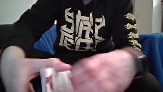 Cute Nerd Opening a Pack of Trading Cards