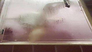 Twink fucks dildo in steamy shower