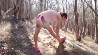 Jogger out on the trail poses her naked body