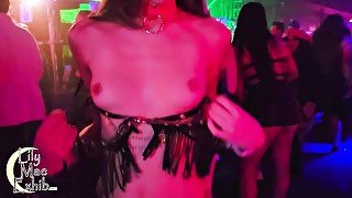 Tits out on the dancefloor at a packed night club!