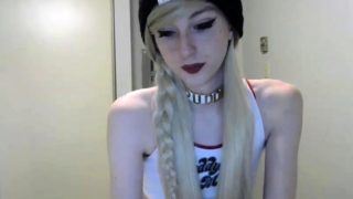 Petite blonde shemale caresses her long shaft on webcam