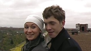 Amateur Russian couple having a walk outdoors on cold day