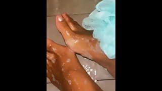 ebony babe soaping up dirty soles in the shower