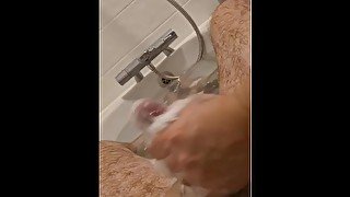 Soapy handjob in the bath