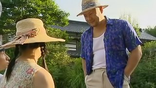 Slutty Japanese chick gets fucked in a village by two dudes