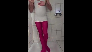 guy getting messy playing with coloured slime in pink pantyhose