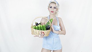 Eccentric blonde shoves several cucumbers into her asshole