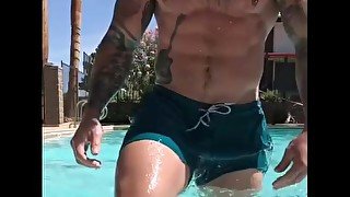 Inked daddy hunk shows off dickprint & muscles at the pool