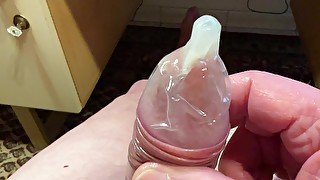 Wank with a condom and cum