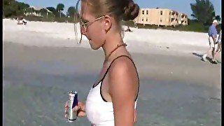 Chick at the beach has fun swimming