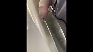 Drip hangs from uncut black dick while at work.